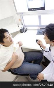 Doctor checking heartbeat