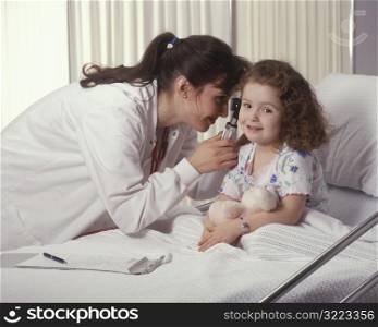 Doctor Checking Little Girl&acute;s Ears