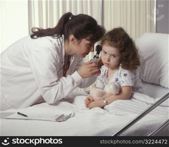 Doctor Checking Little Girl&acute;s Ears