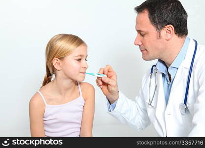 Doctor checking little girl&acute;s temperature