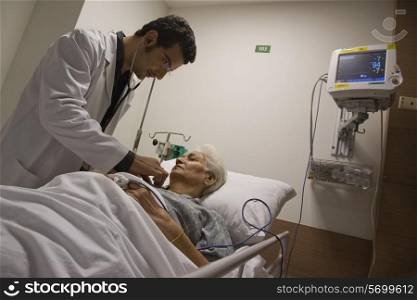 Doctor checking patient&rsquo;s heartbeat