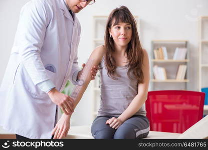 Doctor checking patients joint flexibility