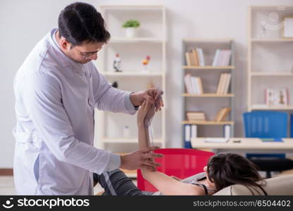 Doctor checking patients joint flexibility