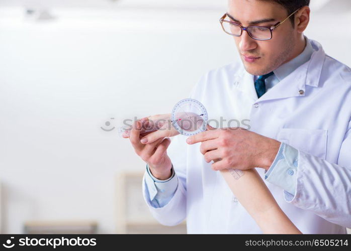 Doctor checking patients joint flexibility