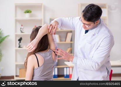 Doctor checking patients joint flexibility