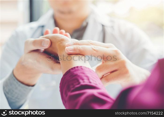 Doctor checking pulse for patients Health care in hospital