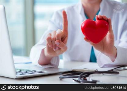 Doctor checking up heart in medical concept