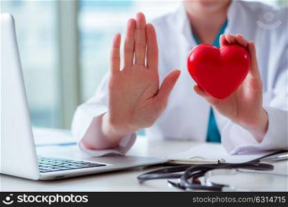 Doctor checking up heart in medical concept