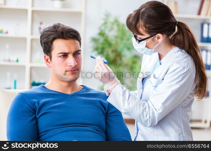 Doctor checking up patient in first aid concept