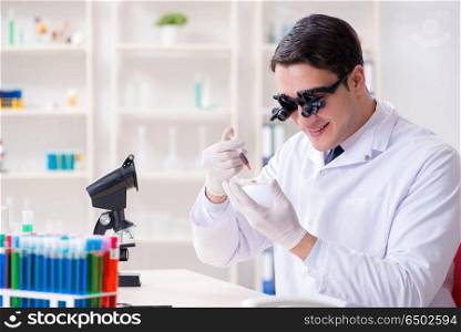 Doctor chemist working on blood samples in lab
