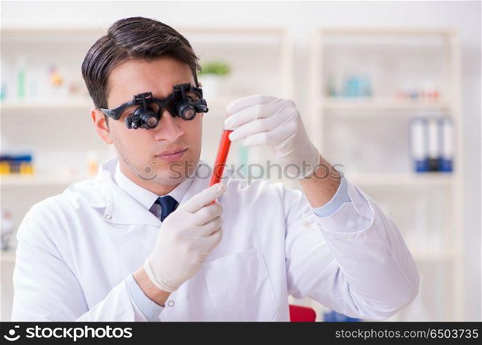 Doctor chemist working on blood samples in lab