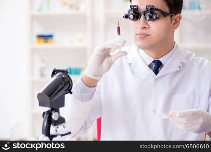 Doctor chemist working on blood samples in lab