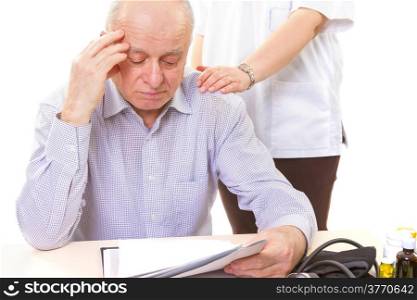 doctor comforting mature stressed patient with headache. doctor with senior patient
