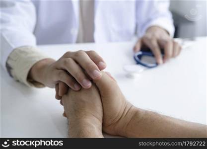 Doctor comforting patient at consulting room