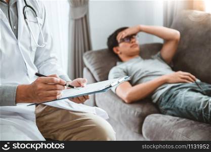 Doctor consulting and diagnostic examining with men&rsquo;s patient health disease and writing on prescription record information document visit patient&rsquo;s home
