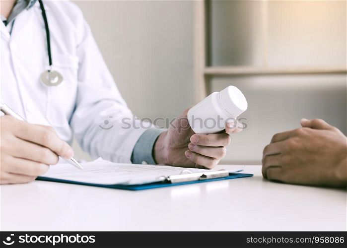 Doctor consulting to patient and talking about medicine.