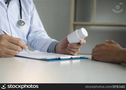 Doctor consulting to patient and talking about medicine.