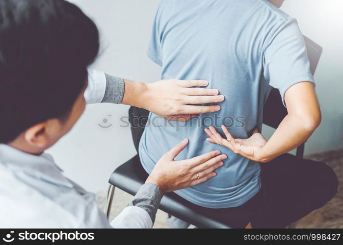 Doctor consulting with patient Back problems Physical therapy concept