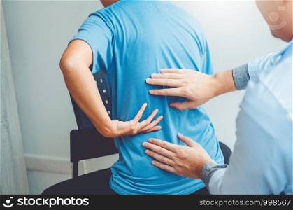 Doctor consulting with patient Back problems Physical therapy concept