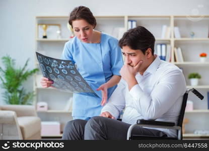 Doctor discussing x-ray image with patient