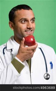 Doctor eating an apple