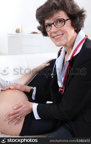 doctor examining a pregnant woman