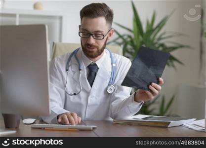 Doctor examining an elbow x-ray. Medicine and healthcare