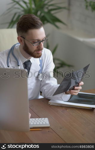 Doctor examining an elbow x-ray. Medicine and healthcare