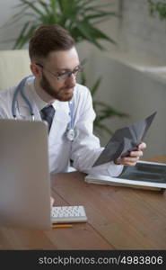 Doctor examining an elbow x-ray. Medicine and healthcare