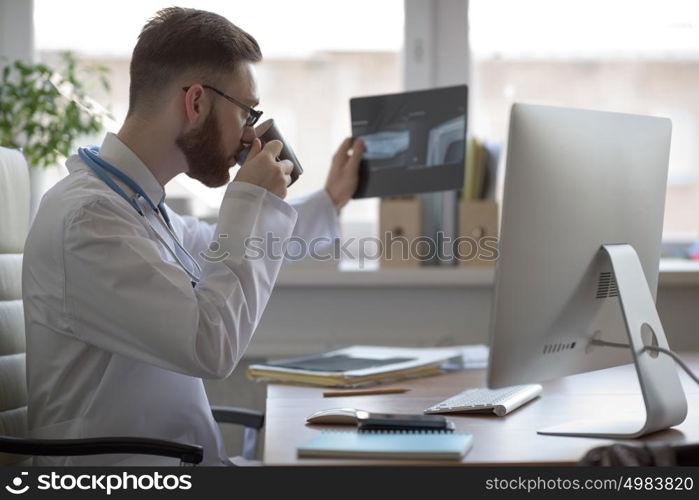 Doctor examining an elbow x-ray. Medicine and healthcare