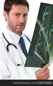 Doctor examining an x-ray