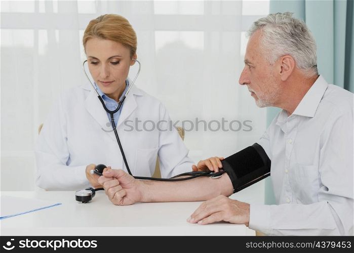 doctor examining blood pressure