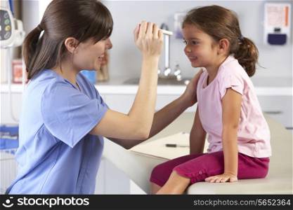 Doctor Examining Child&#39;s Eyes In Doctor&#39;s Office