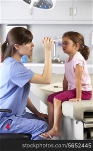 Doctor Examining Child&#39;s Eyes In Doctor&#39;s Office