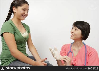 Doctor examining girl in hospital