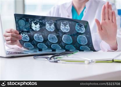 Doctor examining MRI image in hospital. The doctor examining mri image in hospital