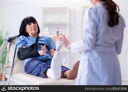 Doctor examining old mature woman after incident
