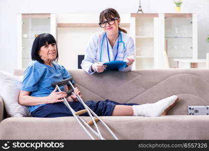 Doctor examining old mature woman after incident