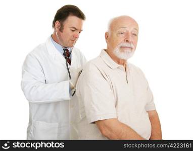 Doctor examining senior man. Both have serious expressions. Isolated on white.