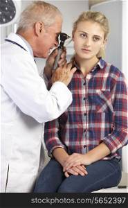 Doctor Examining Teenage Girl&#39;s Ears