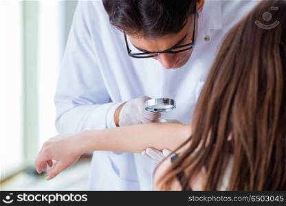 Doctor examining the skin of female patient