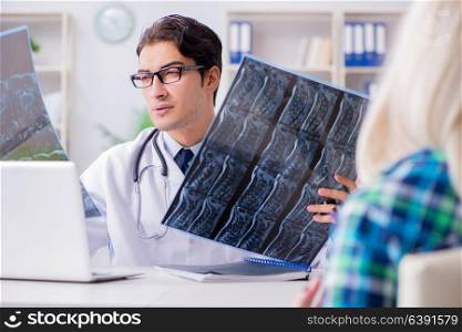 Doctor examining x-ray images of patient