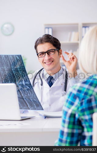 Doctor examining x-ray images of patient