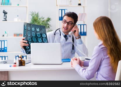 Doctor examining x-ray images of patient