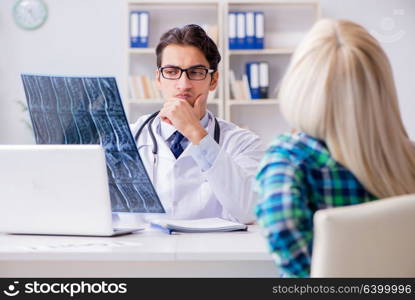 Doctor examining x-ray images of patient