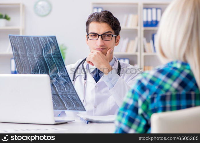 Doctor examining x-ray images of patient