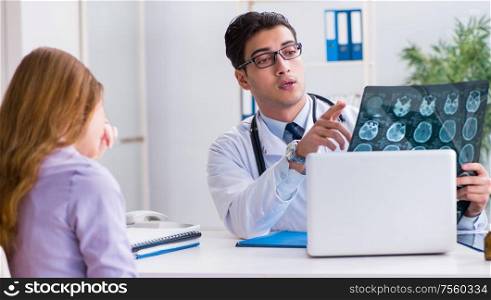 Doctor examining x-ray images of patient. The doctor examining x-ray images of patient