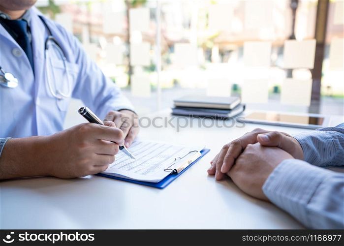 Doctor explaining and giving a consultation to a patient medical informations and diagnosis about the treatment for condition in hospital, medical ethics concept