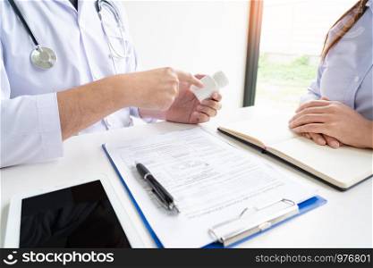 Doctor explaining and giving a consultation to a patient medical informations and diagnosis about the treatment for condition in hospital, medical ethics concept