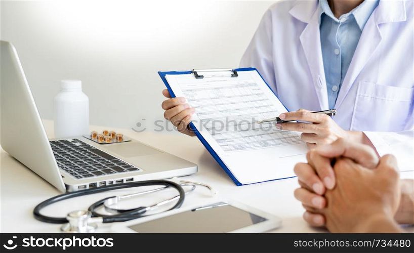 Doctor explaining for patient and showing medical records informations and diagnosis patient symptoms in a consultation and medical insurance concept